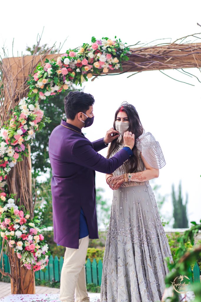 Cute Portrait Picture Arnav making Aparna wear her silver toned bridal face mask that matched with her outfit