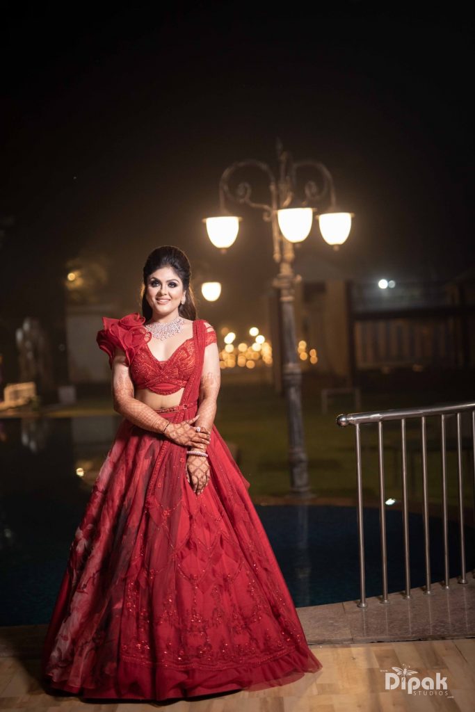 Cherry colour lehenga for a ravishing reception look. 