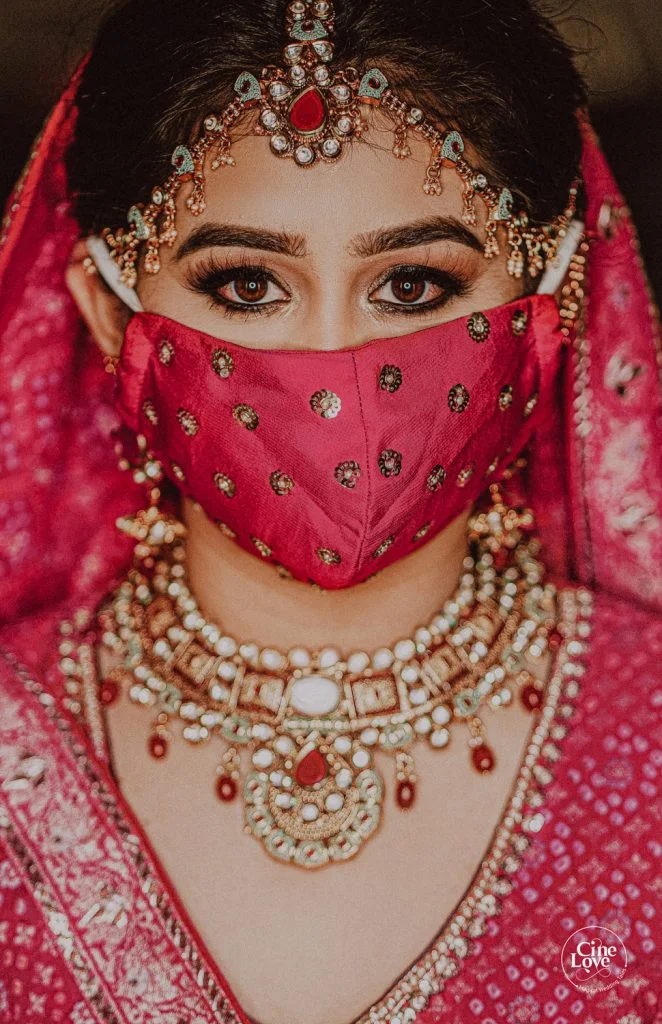 bright hot pink wedding face mask with kohl eyes