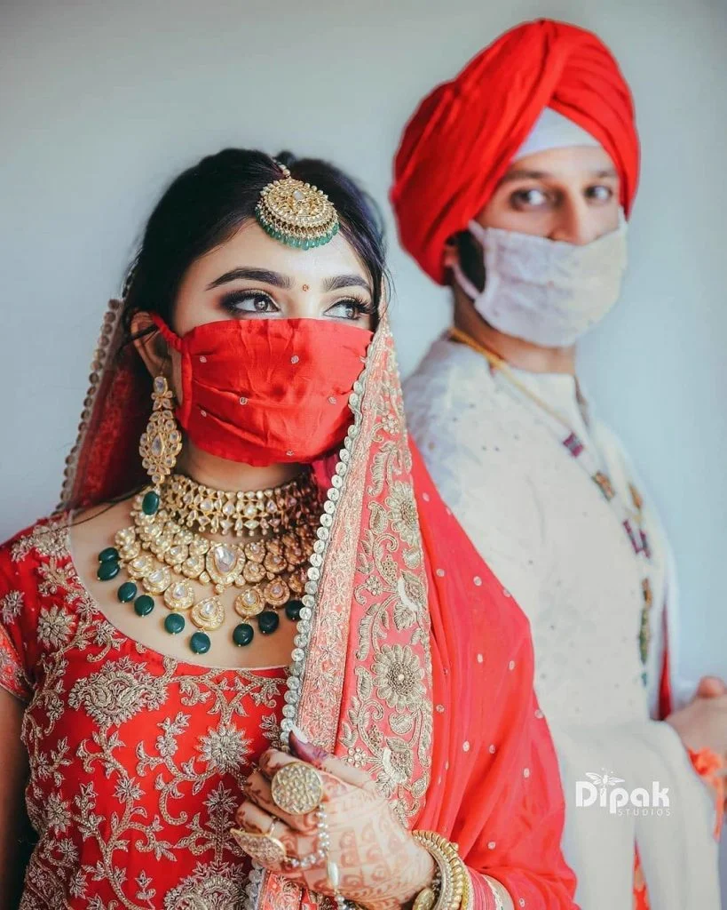 couple posing with wedding simple face masks 