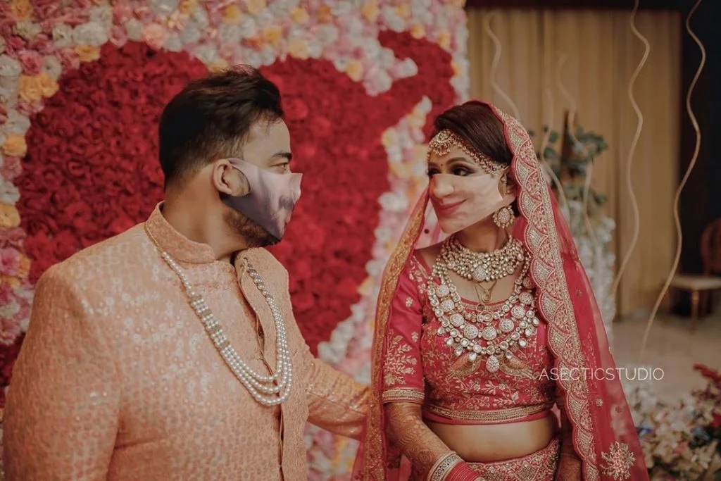 Indian intimate wedding couple with their face print face masks