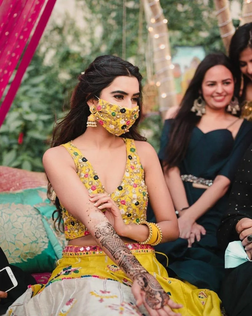 Yellow floral haldi ceremony mask with coordinating blouse