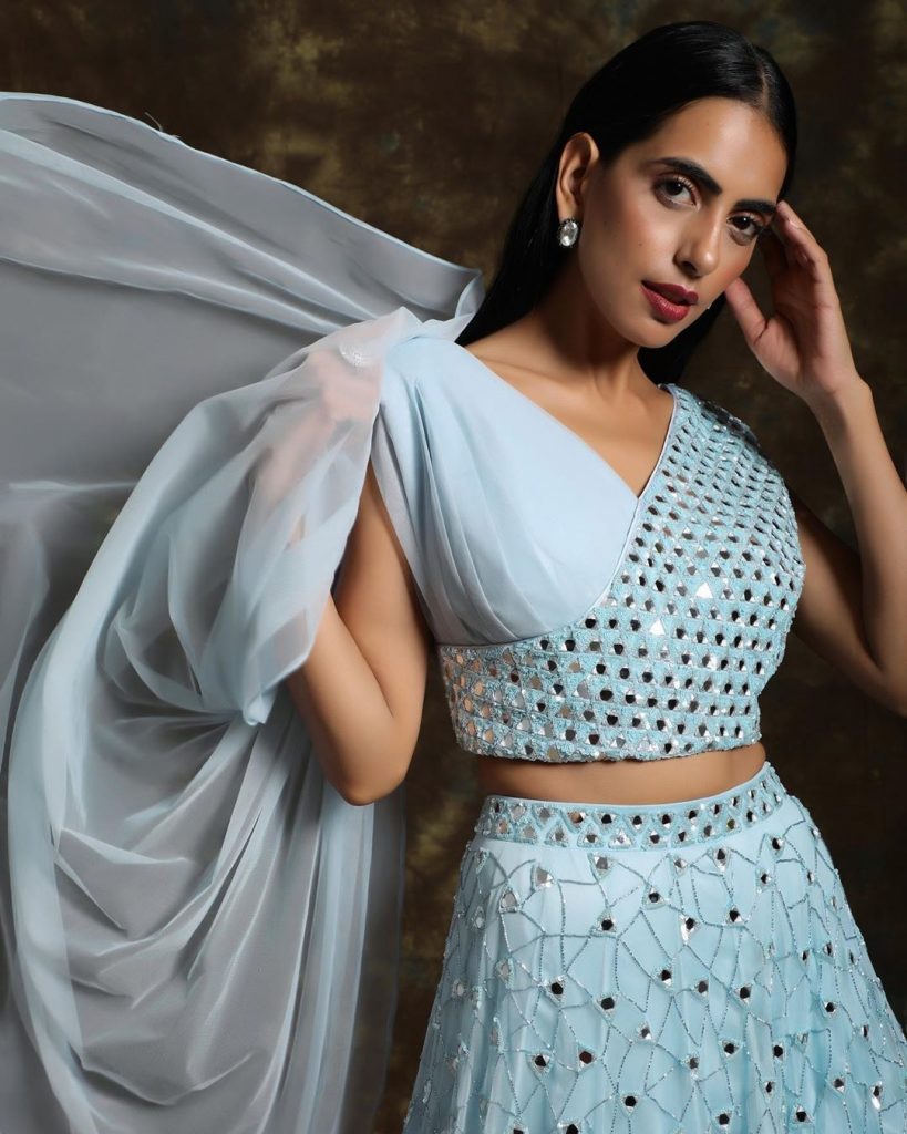 Light blue lehenga blouse design with surplice neck. 