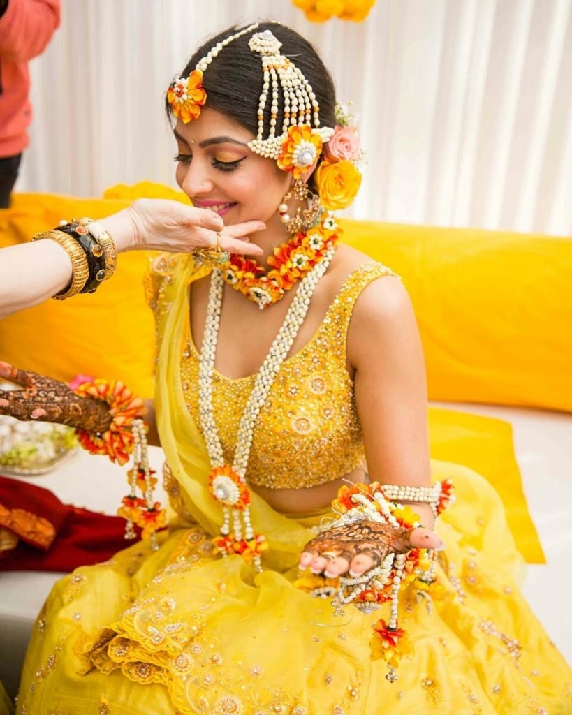 Mustard yellow heavy embellished lehenga blouse. 