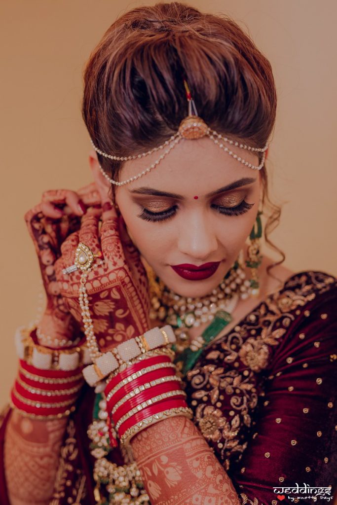 Pale brown glitter bridal eye makeup with high hair bun