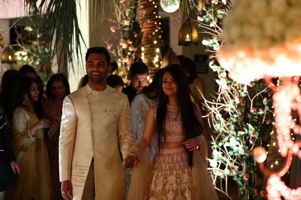 Mrighna & Shallabh in coordinating pastel outfits for their roka ceremony at Taj Usha Kiran Palace Hotel in Gwalior