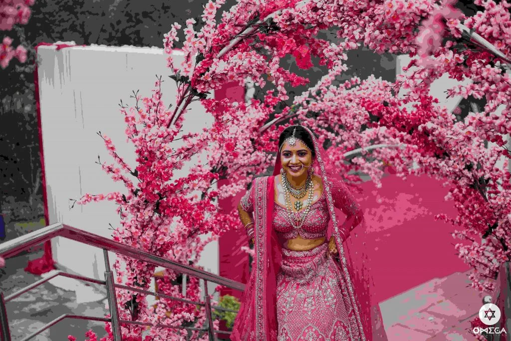 Rani pink lehenga blouse design with distinctive hemline 