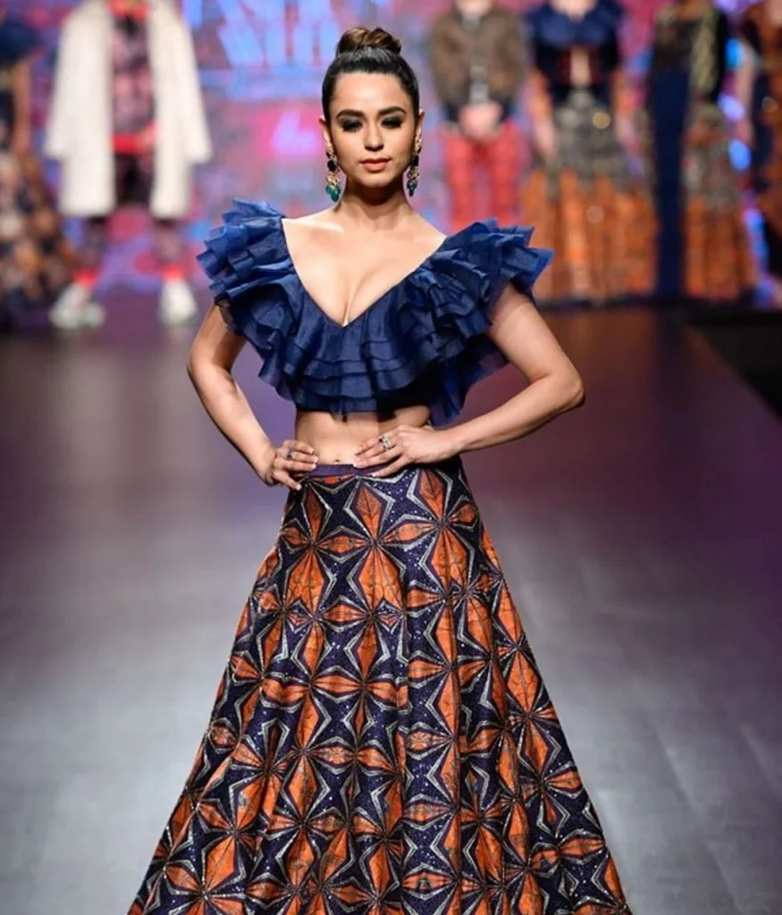 Sexy lehenga choli with plunging neckline and printed skirt. 