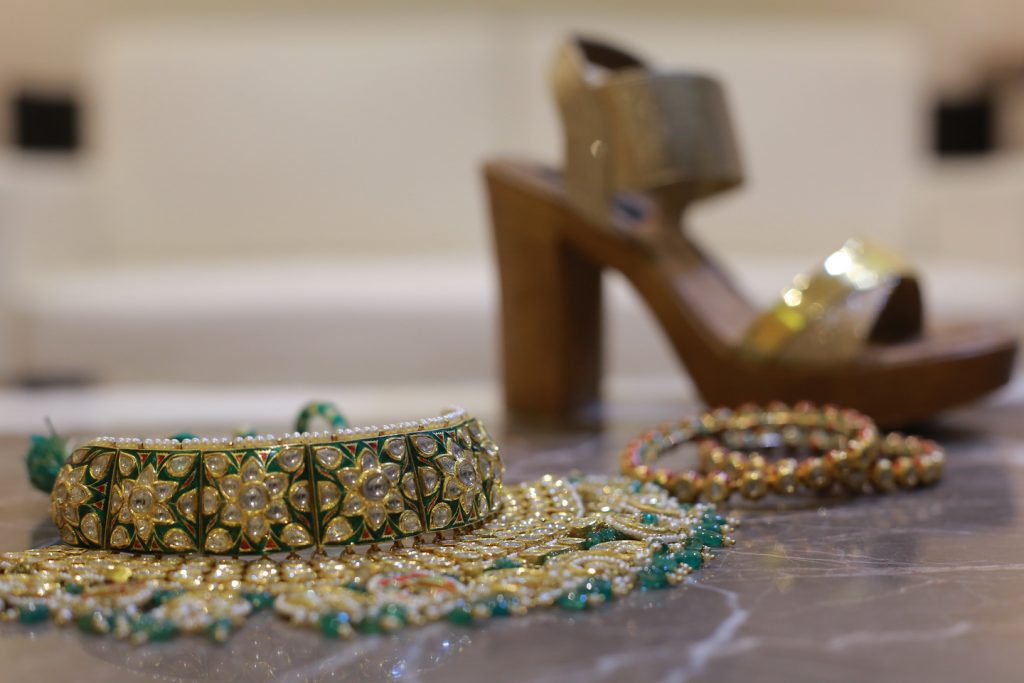 golden green wedding choker with bridal footwear