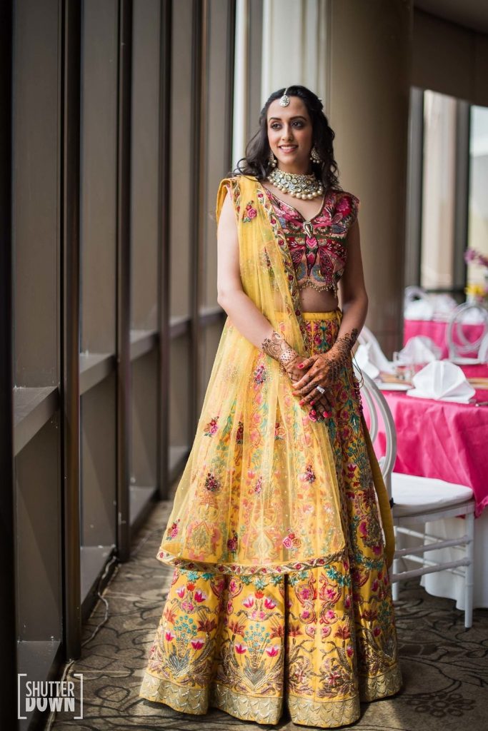 Bright colour lehenga with beaded hangings, perfect for mehendi fuction