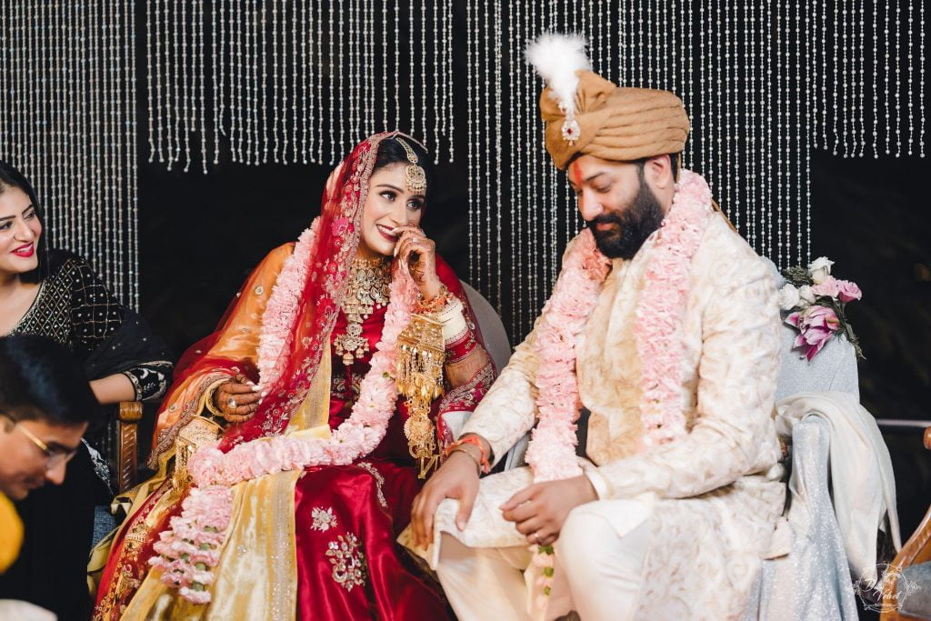 beach wedding candid photography in traditional indian outfits