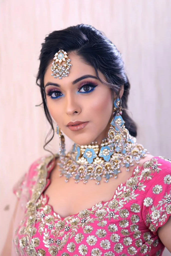 Pratishtha Arora's Mauve pink eye makeup with blue kajal