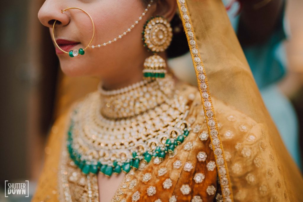 golden green bridal jewellery for destination wedding by Maya Sanghvi
