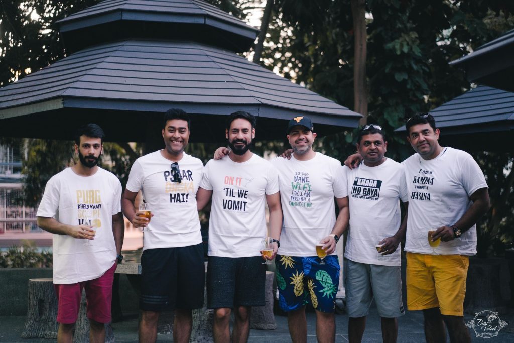 group pool party picture with customised shirts