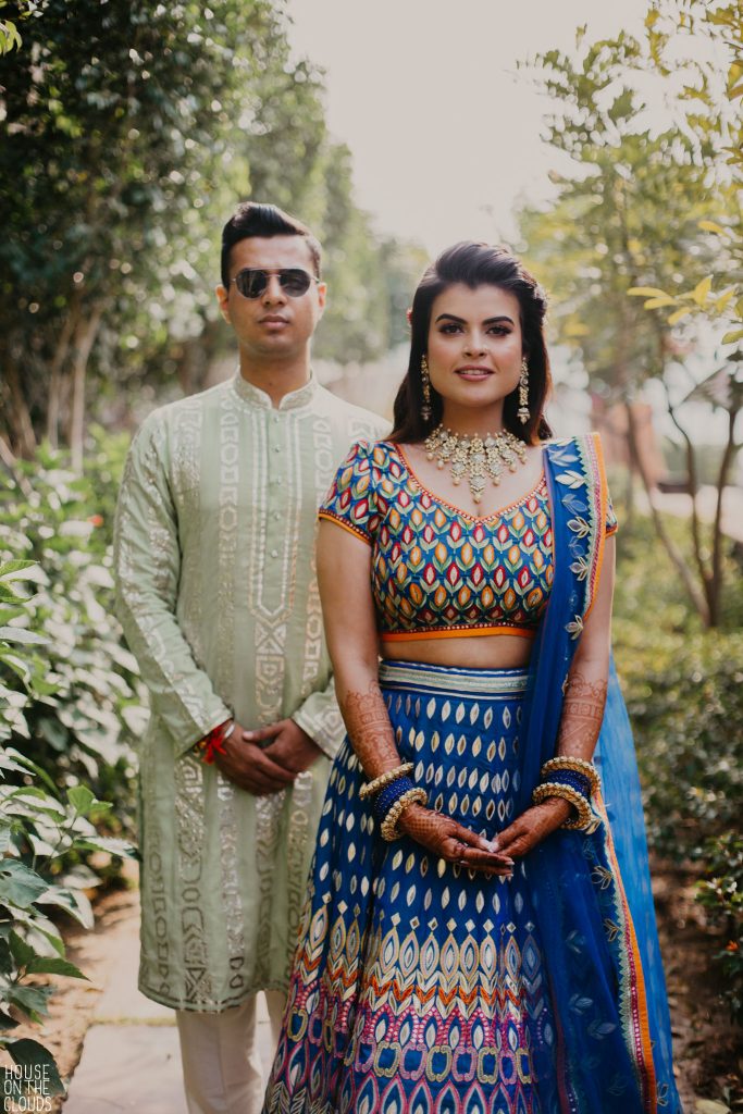 Palak & Pankaj mehndi portrait in designer bridal dresses ‘ASAL’ by Abu Jani Sandeep Khosla