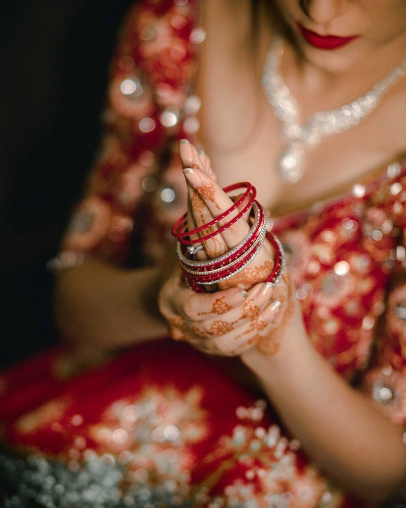 minimalistic nude pink bridal nails with golden french tips