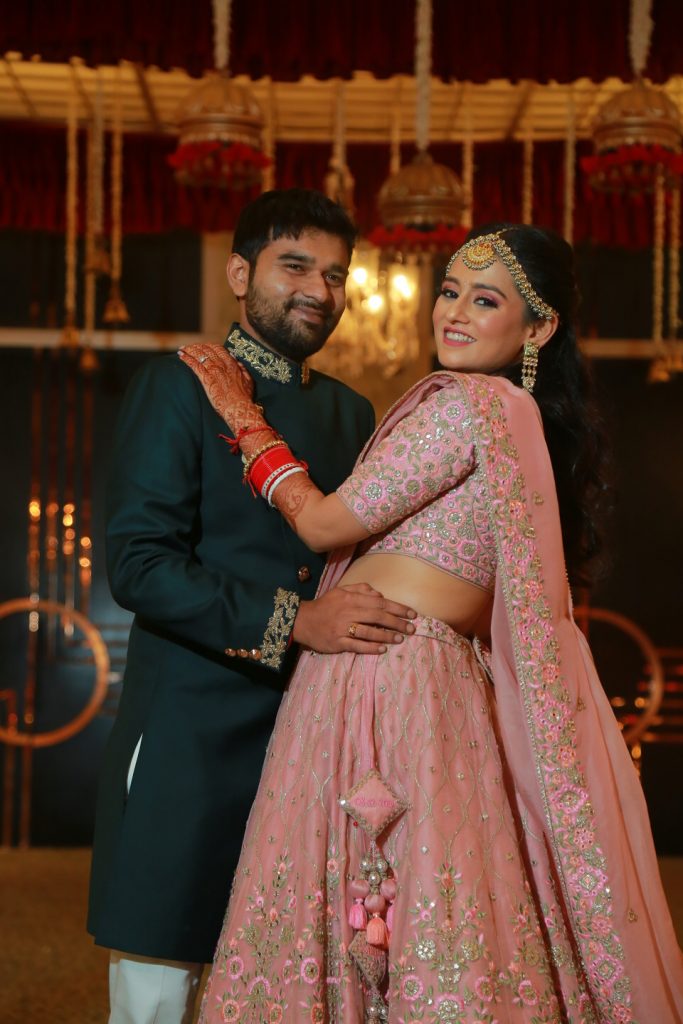 bride and groom posing for reception photoshoot