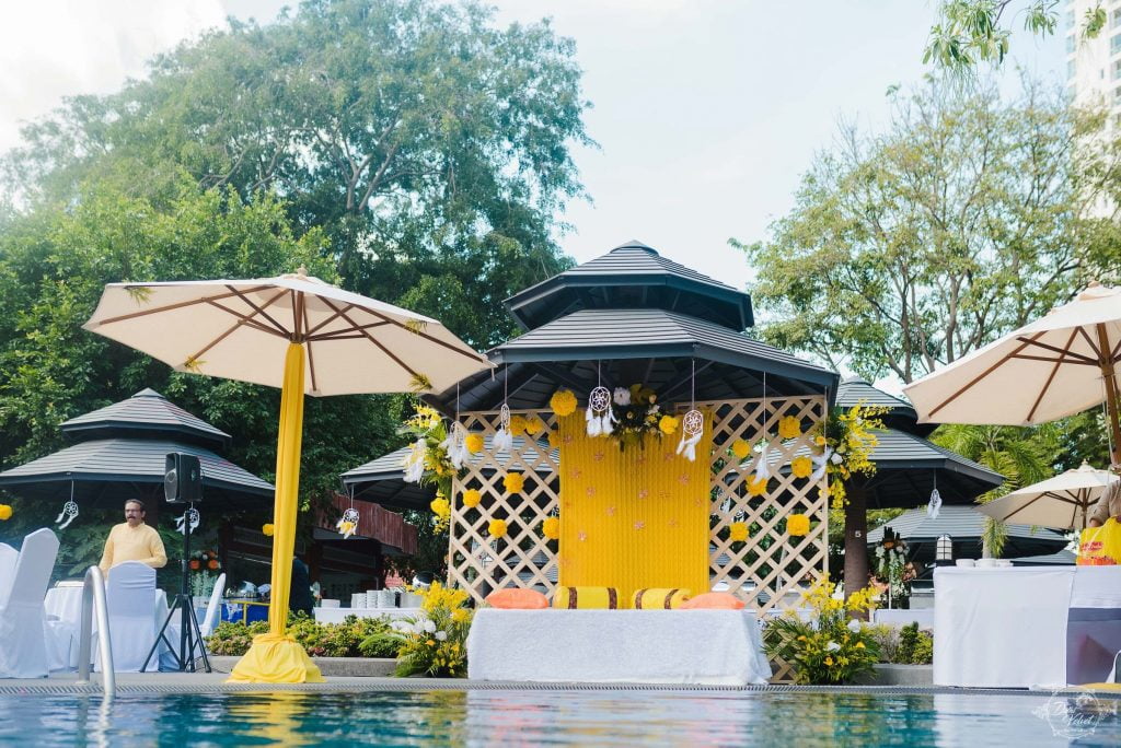 poolside yellow and white haldi function decor for beach wedding in pattaya