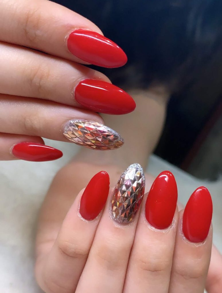 red bridal nails with golden diamond shaped jeweled nail art