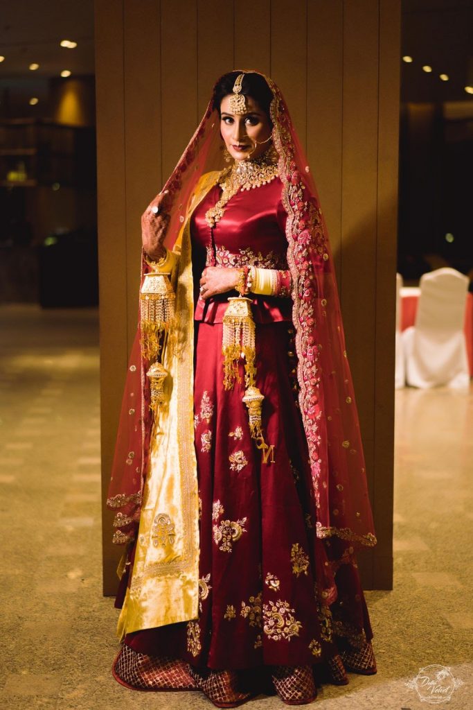 royal red wedding lehenga with golden dupatta