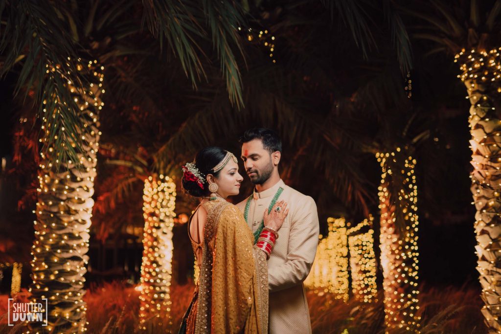 Mrighna & Shallaabh in bridal sabyasachi outfits in Intercontinental Fujairah Resort captured by Ferns and Petals Weddings