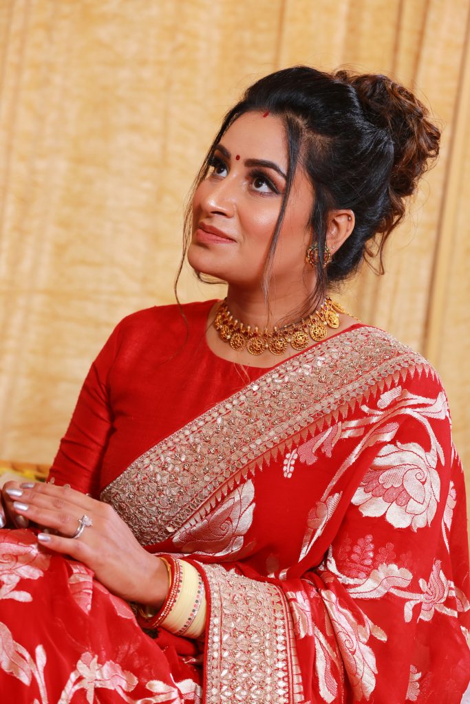 golden bridal choker and silver border red designer saree for wedding reception