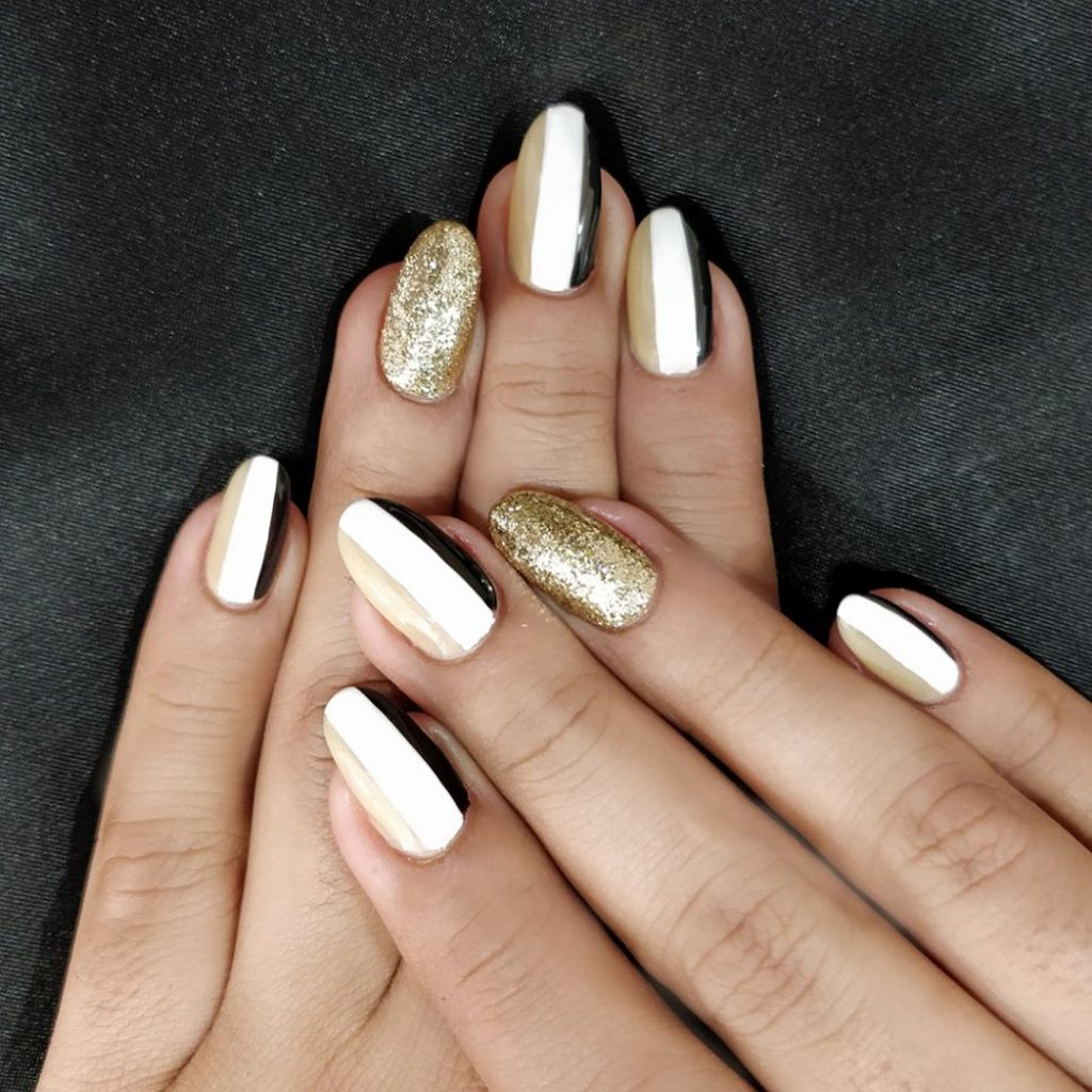 striped golden white black nail art with glitter