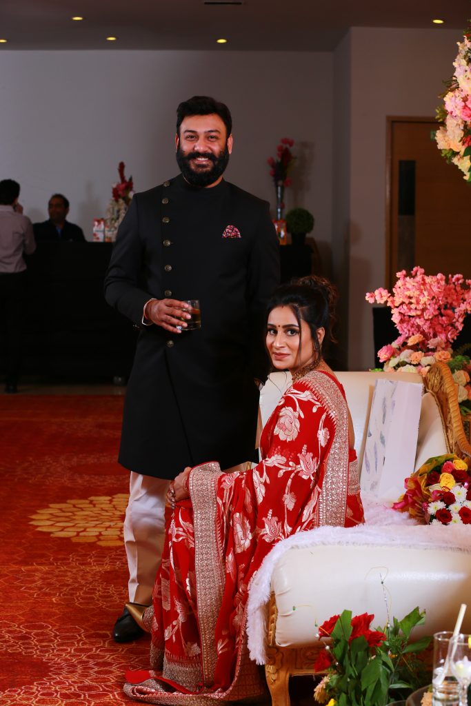 couple photography with bride in red saree and silver border