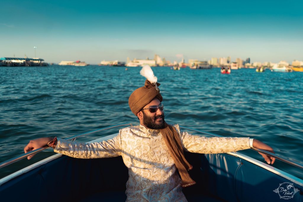 beach wedding groom entry with copper headgear in yacht 