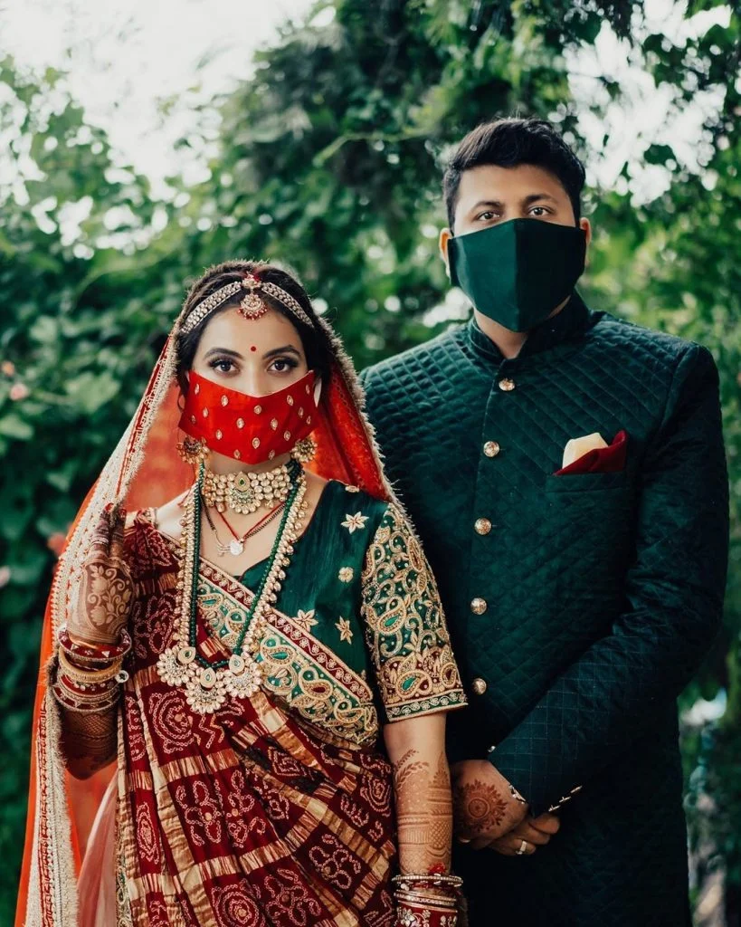 contrasting couple red jeweled and solid dark green face masks