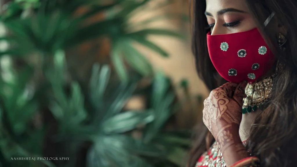 solid red mask with craft flowers for wedding ceremony