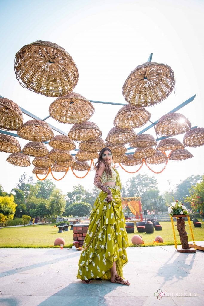bamboo tokri used as ceiling decor with posing bride