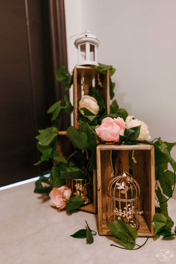 small wooden cane basket with flower vines and golden bird cage decor