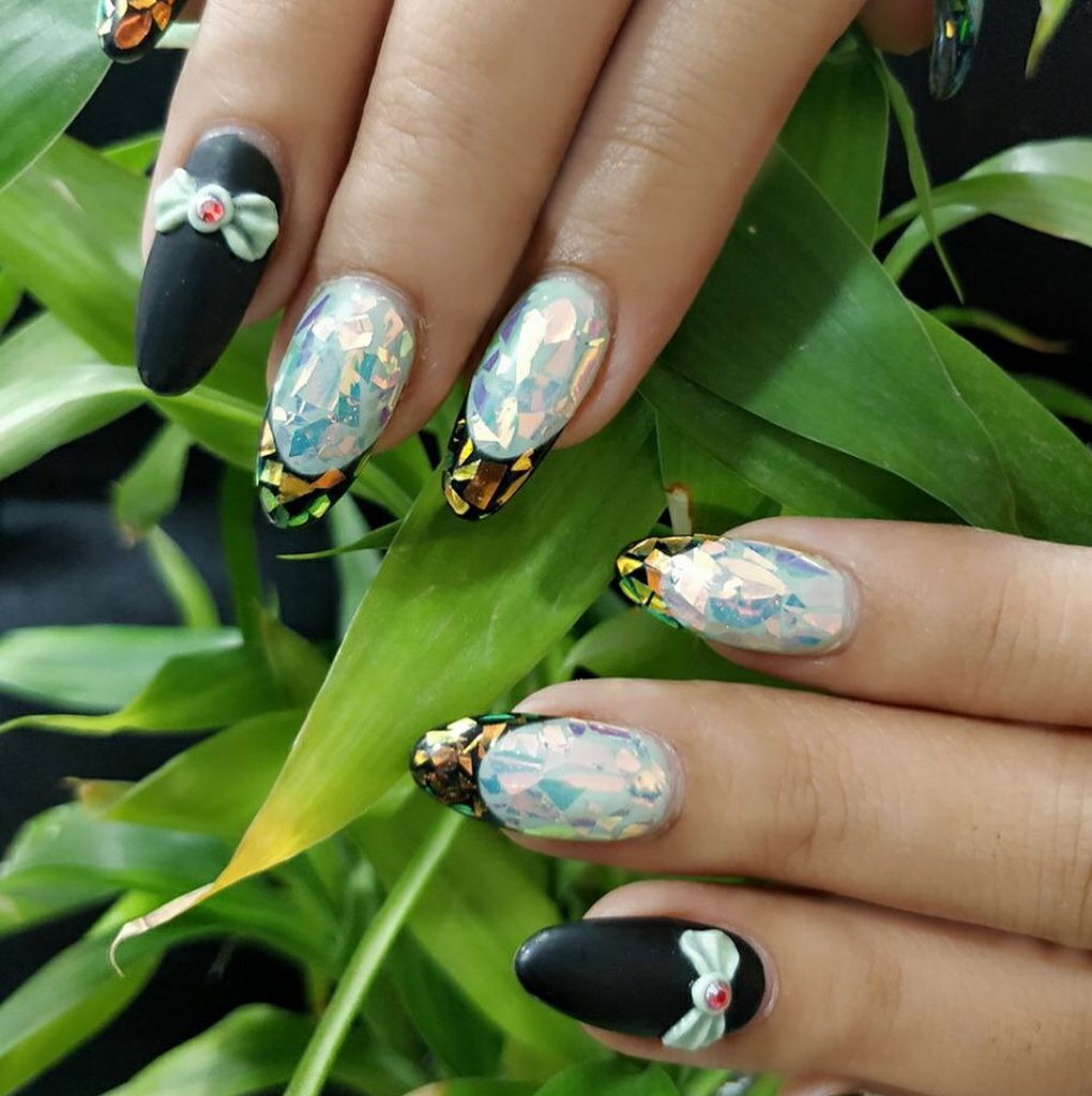 bold blue mosaic mirror nails with gold foiled tips and matte black paint with 3d bow tie accessories 