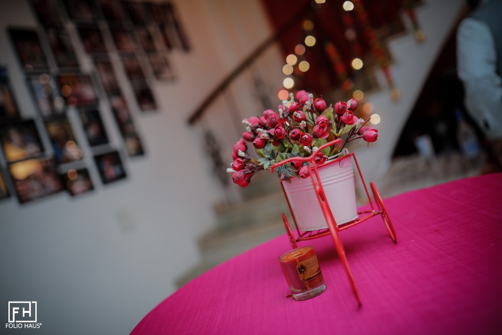 white jar with pink flowers and copper standwhite jar with pink flowers and copper stand