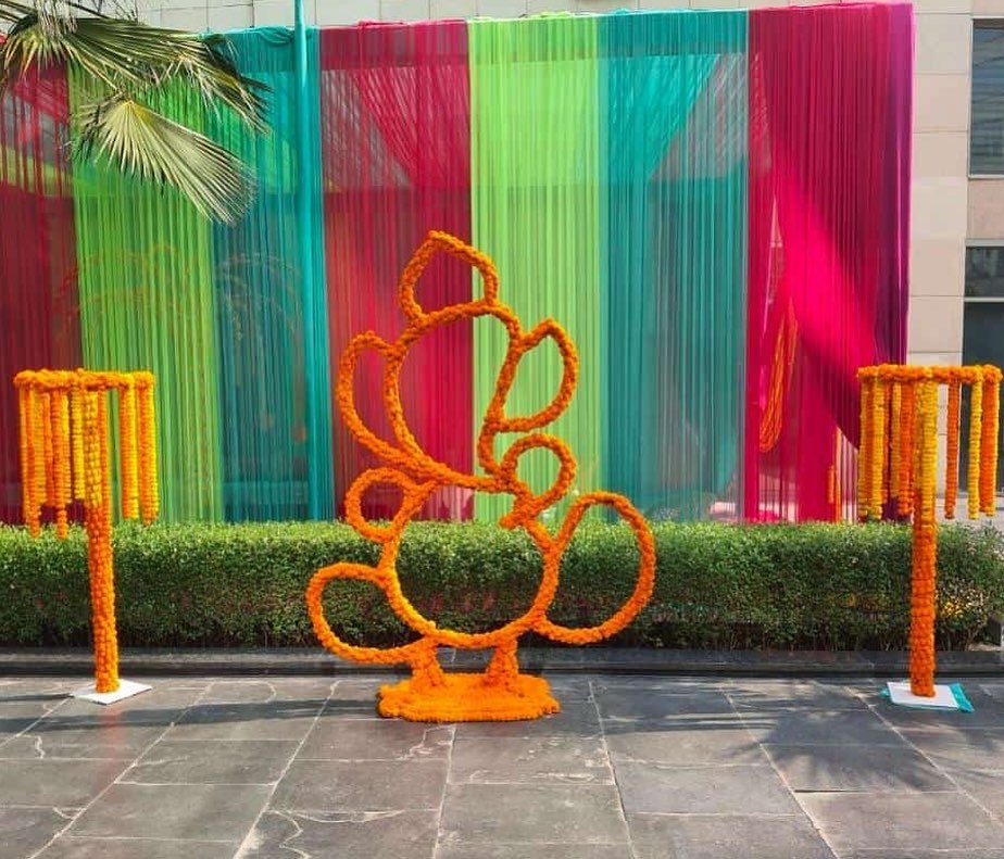 ganesh statue line made with marigold for outdoor wedding decoration