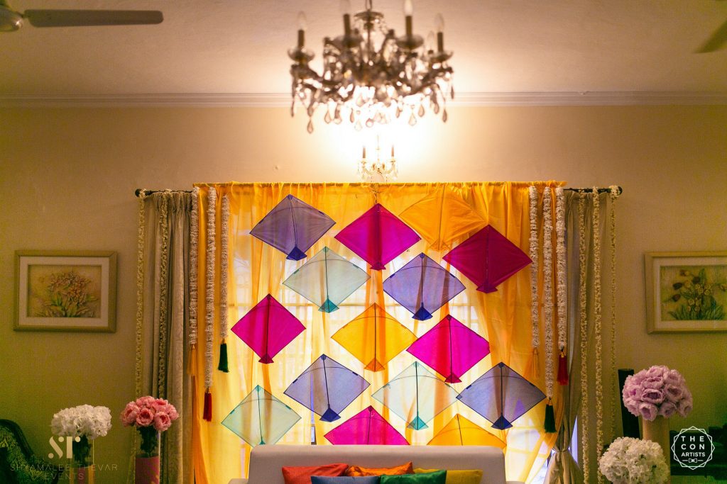 colored kites backdrop for indoor wedding