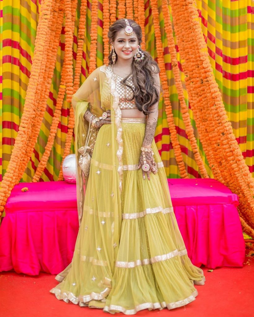 marigold seating arrangement canopy with posing bride