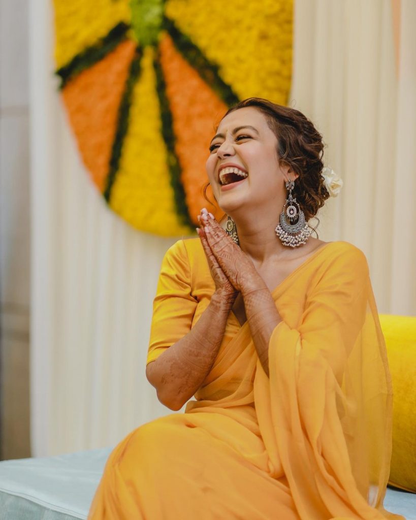 yellow sheer saree for neha kakkar haldi function