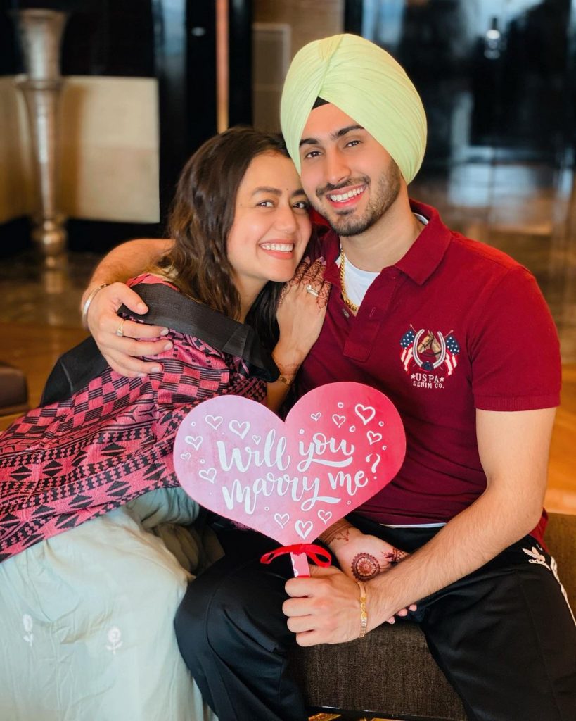 bollywood singer neha hugging fiance rohanpreet after marriage proposal