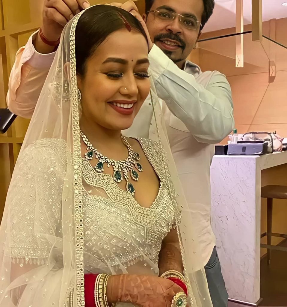 dazzling white neha kakkar wedding reception lehenga 