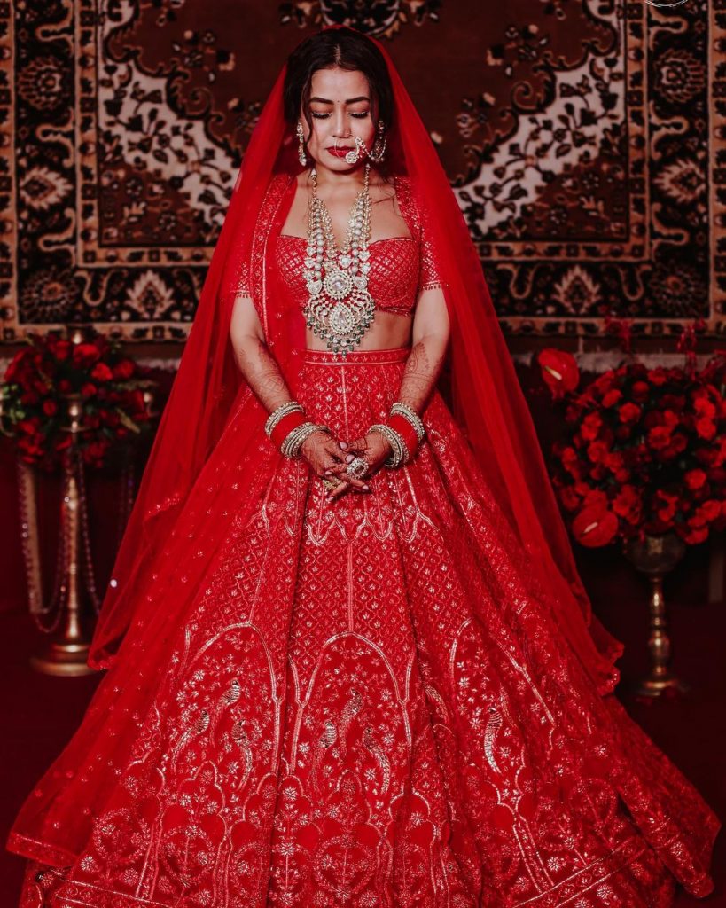 neha kakkar red silver embroidered wedding lehenga 