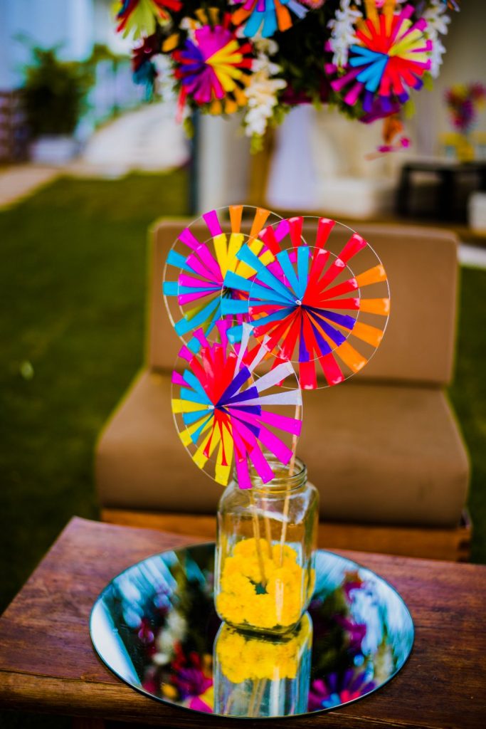 paper pinwheel in a glass jar as centerpiece