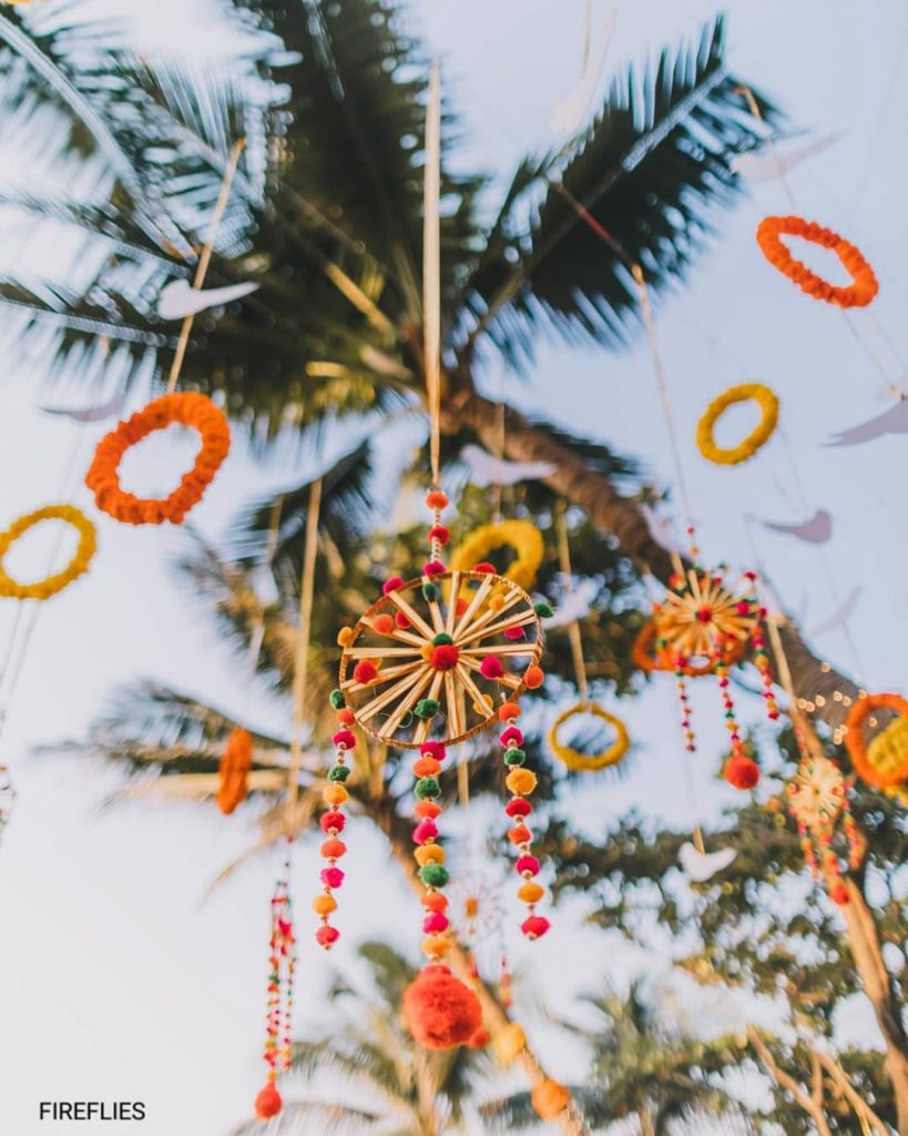 pompoms on wheel hanging outdoor wedding decor