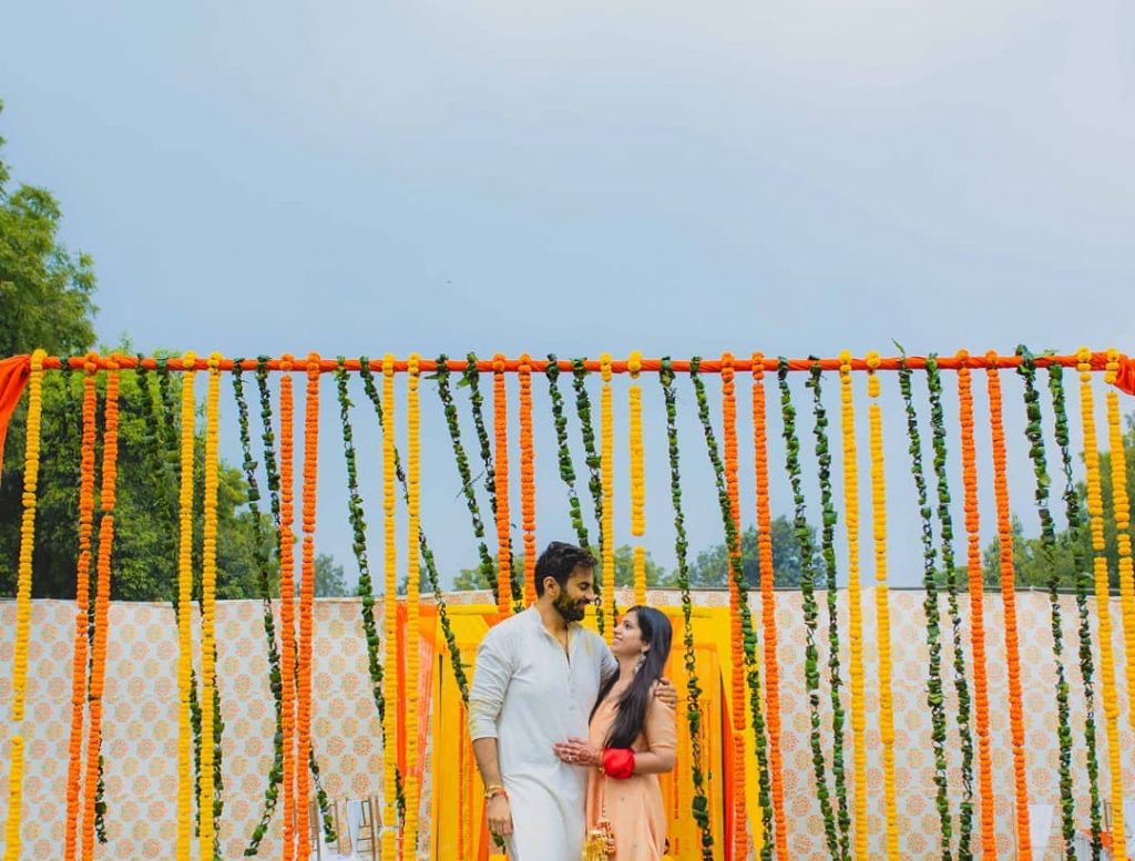 simple marigold hanging as intimate wedding decor