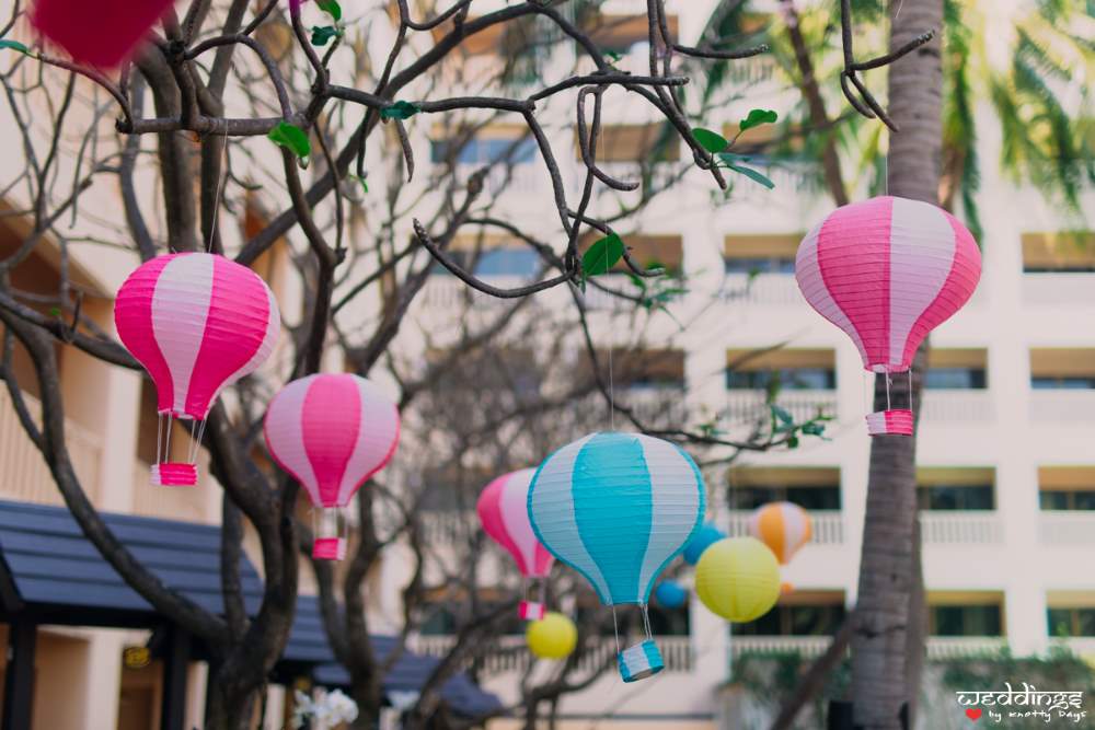 Cute mini parachute decor elements at the pool party before Shalini & Akhil's Dusit Thani Hua Hin wedding