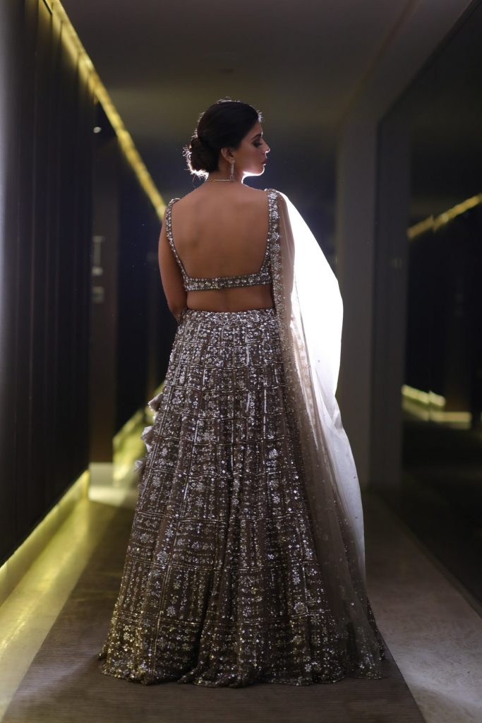 Deep Backless Blouse With Mirror Embellishments For Shimmery Lehenga