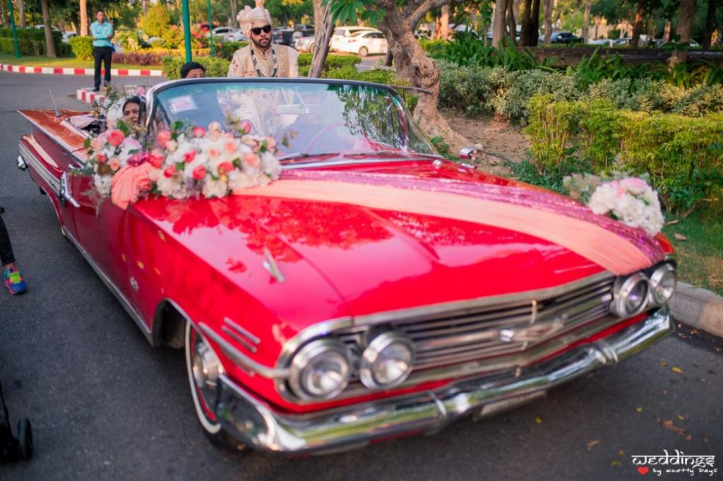 Akhil's entry as the groom in a lavish red car