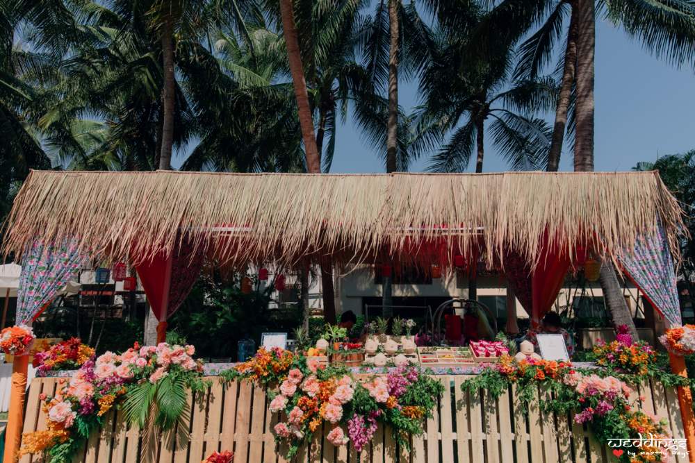 Exotic Hawaiin shed decor at the pool party before the grand Thailand wedding