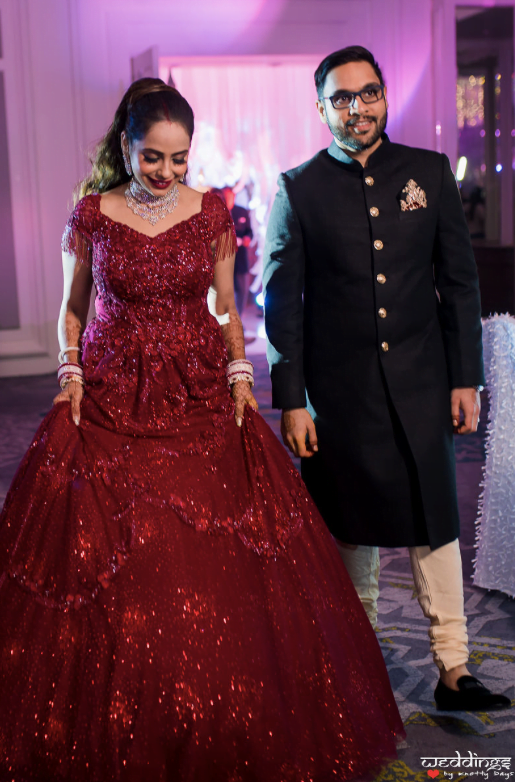 Shalini and Akhil glowing in their designer red bridal gown and sherwani for their Dusit Thani Hua Hin Wedding Reception